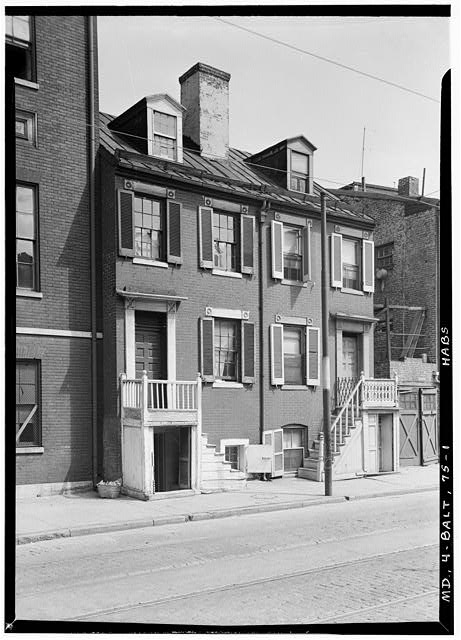 Large-format black-and-white photograph of a Victorian or Craftsman-era house exterior, showing roofline, siding, windows, trim, and front porch in sharp architectural detail.